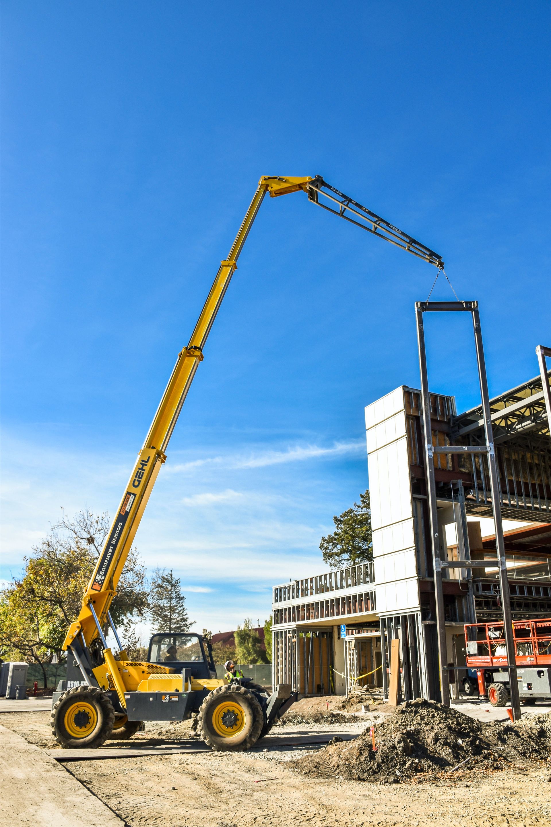 Crane lifts concrete wall