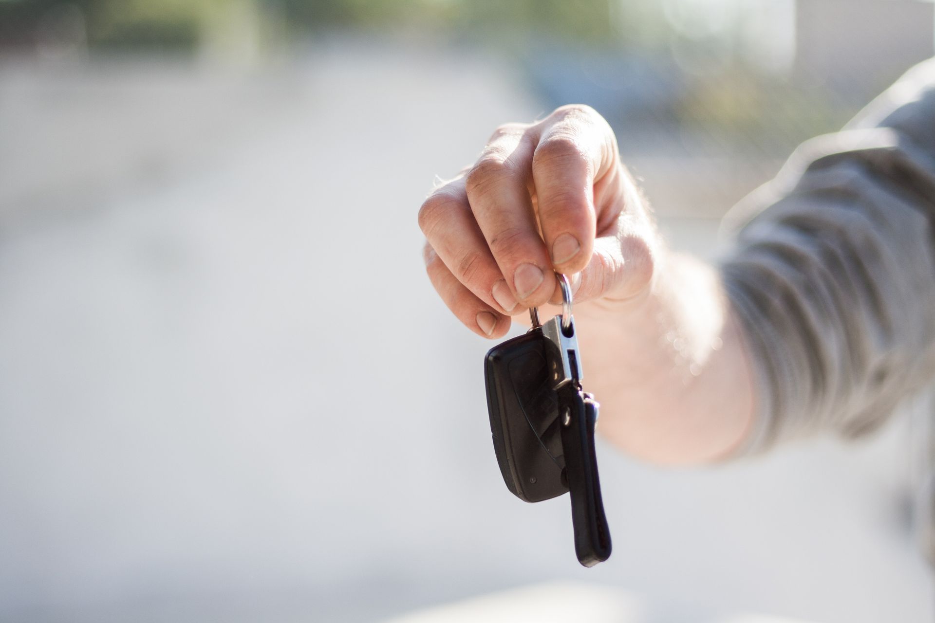 Man handing over car keys